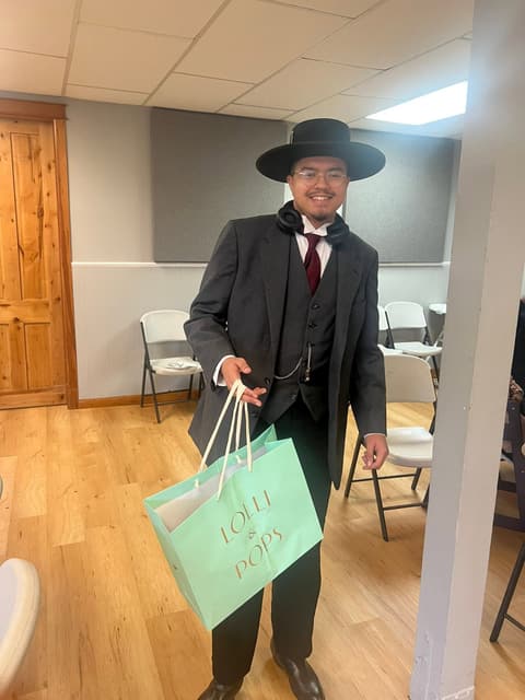 Families receiving gifts at the Romans 116 Church Christmas Giveaway (3)